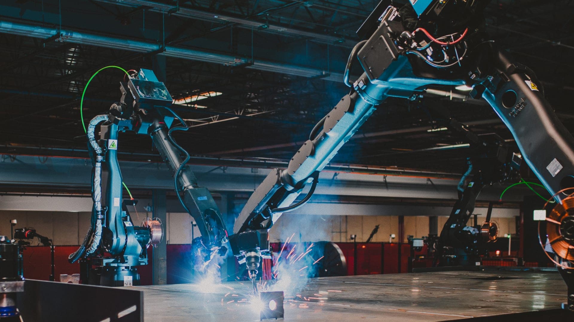 Welding cell with robot arm